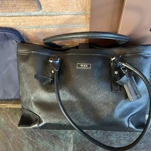 Tumi black faux leather travel bag